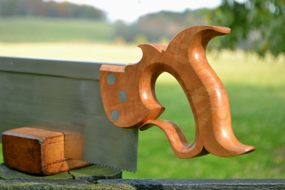 Handle closeup view of 14 inch sash saw in cherry crotch