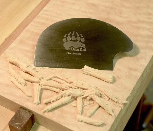 BearKat Wood chair scraper in use on curly maple