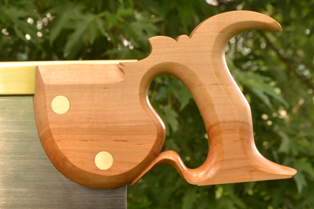Closeup of handle on Kenyon Seaton 19 inch tenon saw in apple